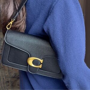 Like new Chic Black Crossbody Bag with Gold Accents, tabby style